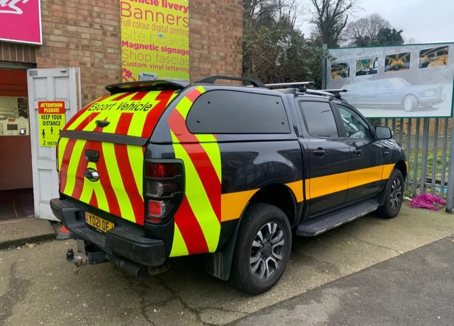 Escort vehicle side and rear Chapter 8 compliant chevron markings by Talion Graffix